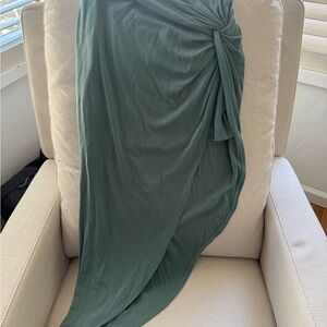 Lulu's “Put a spin on it” sage green twist-front high-low midi skirt